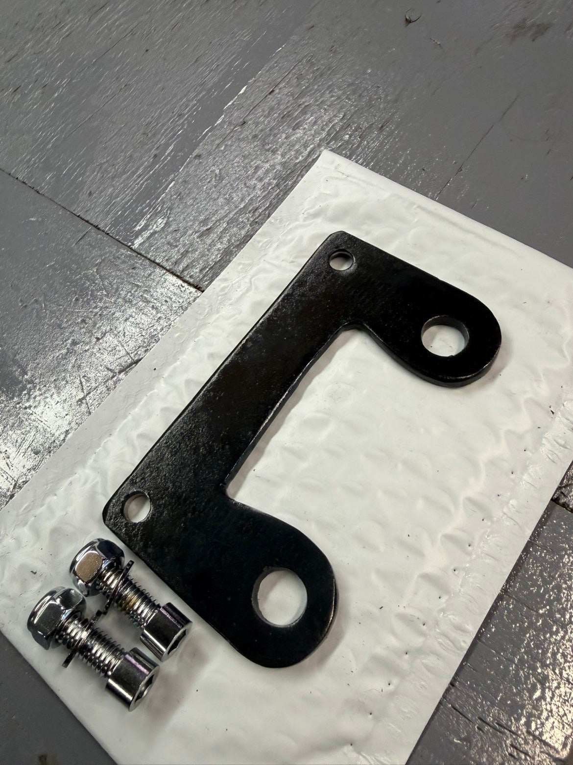 Iron Heart Cycles’ Top Mount Headlight Relocation Bracket